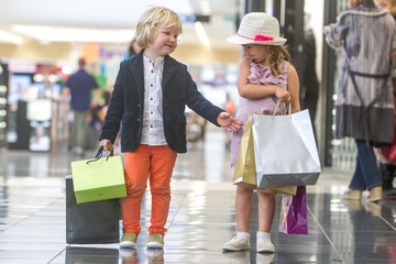 Kids shopping. cute little girl and boy on shopping. portrait of