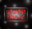 Black Friday glowing text on a metal plate