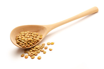 Wall Mural - Raw lentil in wooden spoon