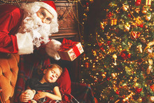 Santa Claus Presents Christmas Gift To Sleeping Child Girl In Ch