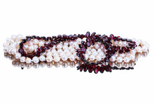 Pearl And Garnet Necklace On A White Background, With Reflection