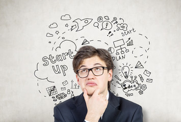 Poster - Thinking man with startup sketch on concrete