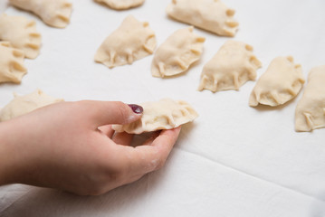 Prepared dumplings on cotton cloth.