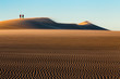 walking on dune de pilat at sunrise