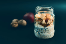 Preparation Overnight Breakfast With Flakes Of Oats, Chia, Apple, Nuts.