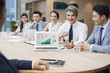 © Blue Jean Images - Business people having meeting in board room