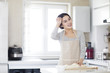 © Blue Jean Images - Young woman kneading dough on cutting board