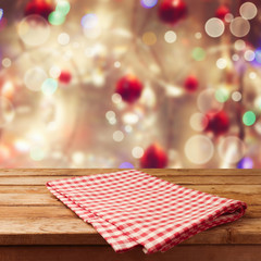 Christmas holiday background with empty wooden table and tablecloth. Ready for product montage