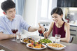 © Blue Jean Images - Romantic young couple dining at home