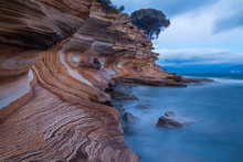 Painted Cliffs On Maria Island National Park, Tasmania, Australia. Eroded Layers Of Iron Oxide Form Interesting Patterns In The Coastline.