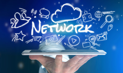 Concept of man holding tablet with network icon around