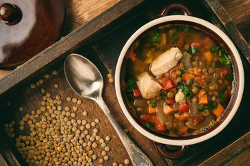 Hot soup with green lentil, chicken, vegetables and spices.