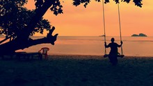 Silhouette Of Beautiful Girl Relaxing On A Swing At The Beach