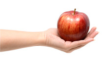 A Hand Holding Apple Isolated On White Background
