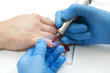 © lester120 - Woman doing manicure beauty salon varnish wellness