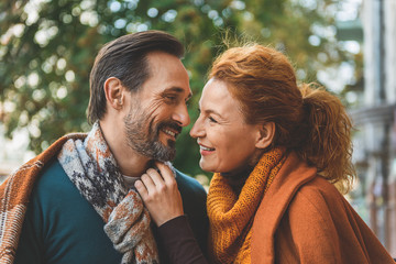 Joyful loving couple hugging outside