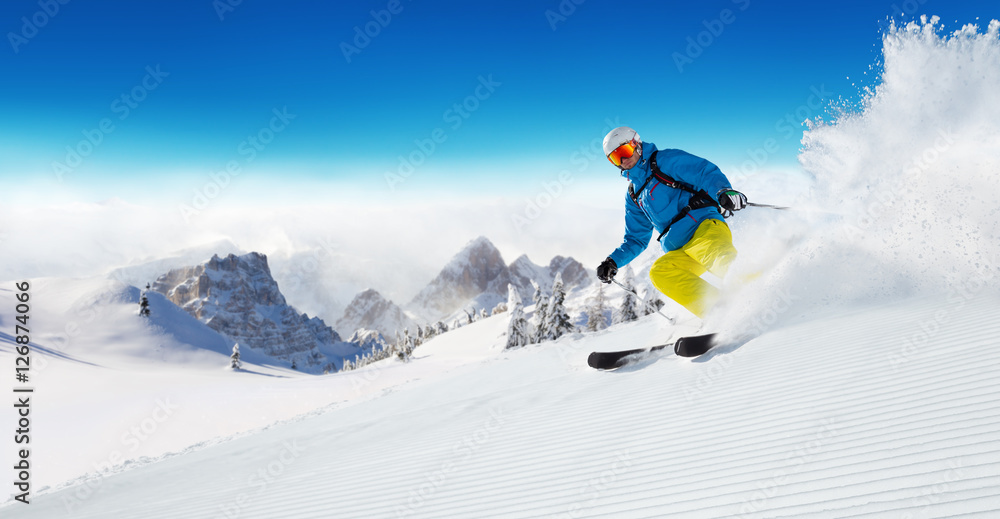 Skier on piste running downhill - obrazy, fototapety, plakaty 