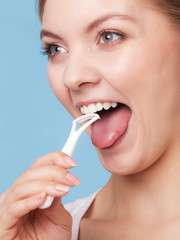 Wall Mural - Girl cleaning tongue. Dental care oral hygiene.