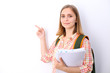 © rogerphoto - Happy young student girl holding books, study, education, knowledge, goal concept