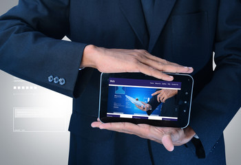 Wall Mural - business man showing web page on tablet