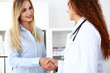 © megaflopp - Female doctor shake hand as hello with beautiful blonde patient