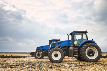 Poster - Two tractor cultivating the land