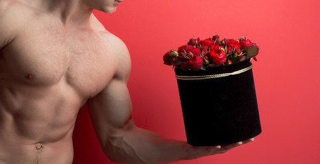 Wall Mural - sexy muscular man with roses