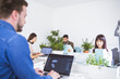 © LStockStudio - Men and women working in office