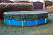 Garden pool in the winter covered with frost