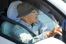 Senior Person Driving A Car