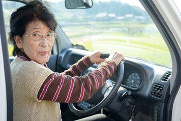 Senior person driving a car