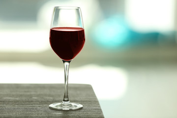 Canvas Print - Glass with red wine on table