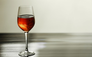 Canvas Print - Glass with red wine on table