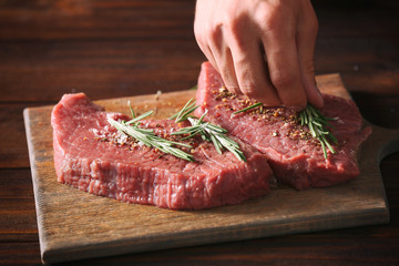 Canvas Print - Butcher cooking pork meat on kitchen