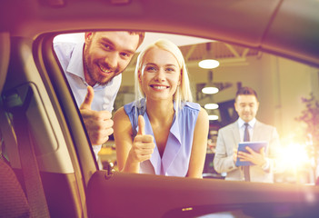 Poster - happy couple with car dealer in auto show or salon