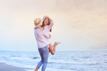 Young happy couple on seashore