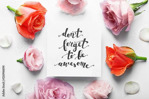 Poster Inscription "DON'T FORGET TO BE AWESOME" written on paper with flowers on white