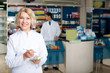 © JackF - Pharmacist and pharmacy technician posing in drugstore
