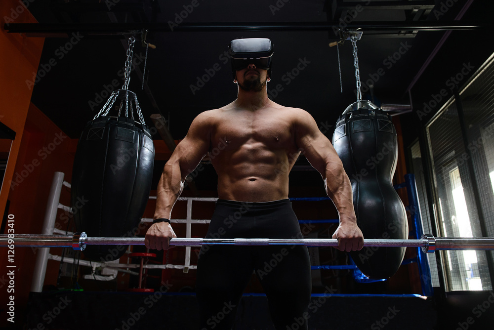 Fit man with VR headset/Young muscular bodybuilder with virtual reality ...