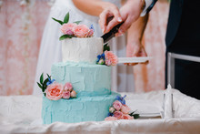 Beautiful Turquoise Festive Cake Cutting By The Newlyweds At The Wedding Ceremony