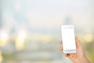 Wall Mural - Woman holding blank white cellphone