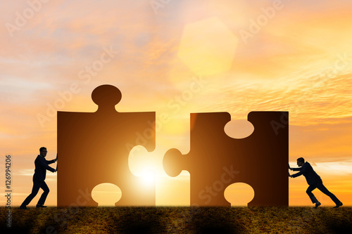 Fotografie, Obraz Business concept of teamwork with jigsaw puzzle