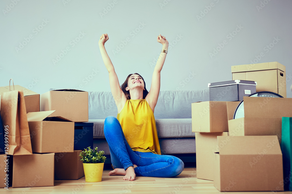 Happy young woman moving to new home - having fun - obrazy, fototapety, plakaty 