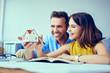 © baranq - Happy couple planning new home design