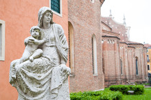 The Statue Of The Virgin Mary And The Baby At One Side Of Santa Maria Annunciata Cathedral In Vicenza, Italy