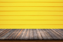 Wood Table On Yellow Wood Wall For Background.