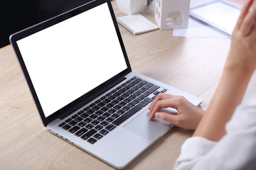 Poster - Business woman using mock up laptop on wooden desk