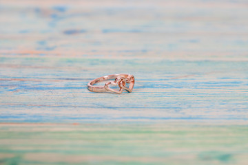 Wedding rings on wooden table