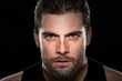 © elnariz - Handsome male athlete body builder with facial hair and intense eyes on isolated black background