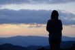 © btogether.ked - silhouette women standing on mountain background